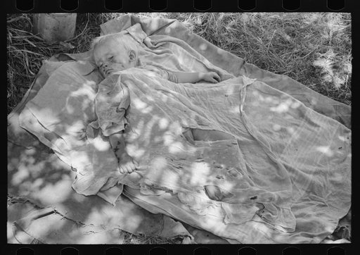 Untitled photo, possibly related to: Child of family encamped by the roadside near Spiro, Oklahoma. This family is doing agricultural day labor to secure funds to continue westward. Sequoyah County, Oklahoma