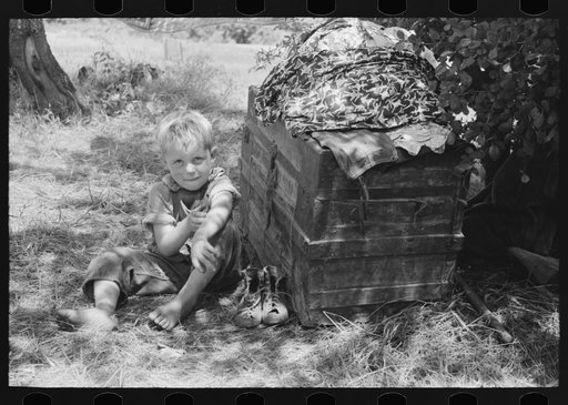 Child of agricultural family camped by the roadside near Spiro. Sequoyah County, Oklahoma