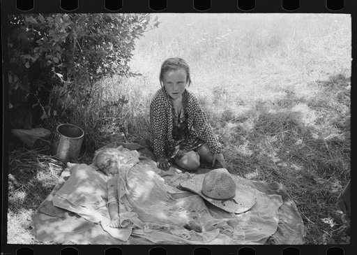 Untitled photo, possibly related to: Children of agricultural day laborers camped by the roadside near Spiro, Oklahoma. There were no beds and no protection from the profusion of flies