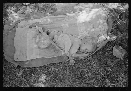 Baby of agricultural family camped by the roadside near Spiro. Sequoyah County, Oklahoma