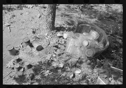 Tin cans and glass jars near camp of agricultural day laborers camped near Spiro. Sequoyah County, Oklahoma