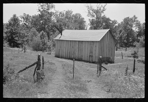Home of agricultural day laborer near Sallisaw, Oklahoma. Notice absence of windows. Sequoyah County, Oklahoma