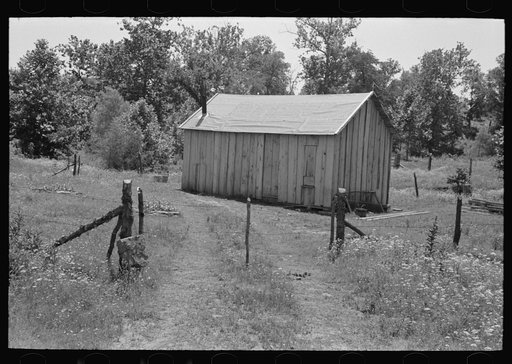 Untitled photo, possibly related to: Home of agricultural day laborer near Sallisaw, Oklahoma. Notice absence of windows. Sequoyah County, Oklahoma