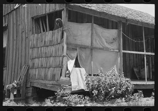 Porch of WPA (Work Projects Administration) worker who was tenant farmer until a few years ago, near Sallisaw, Oklahoma