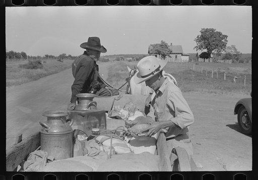 Untitled photo, possibly related to: Farm wagon leaving small grocery store on Saturday afternoon, McIntosh County, Oklahoma