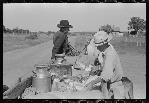Farm wagon leaving small grocery store on Saturday afternoon, McIntosh County, Oklahoma