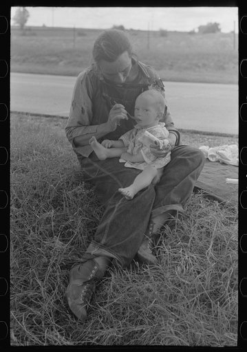Untitled photo, possibly related to: Migrant mother feeding her baby while the family was stopped by the roadside for lunch, east of Fort Gibson, Muskogee County, Oklahoma