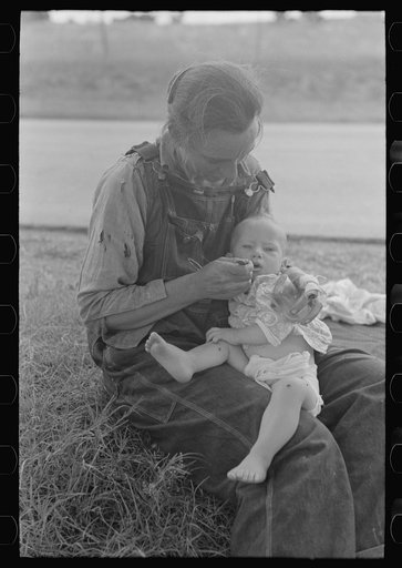Untitled photo, possibly related to: Migrant mother feeding her baby while the family was stopped by the roadside for lunch, east of Fort Gibson, Muskogee County, Oklahoma