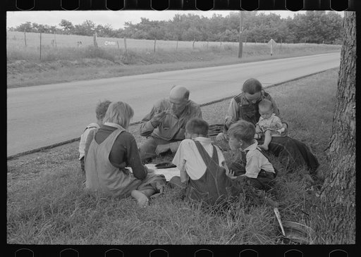 White migrant family eating lunch of blackberry pie on the highway east of Fort Gibson, Oklahoma