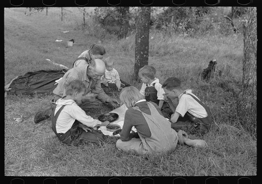 Untitled photo, possibly related to: White migrant family eating lunch of blackberry pie on the highway east of Fort Gibson, Muskogee County, Oklahoma