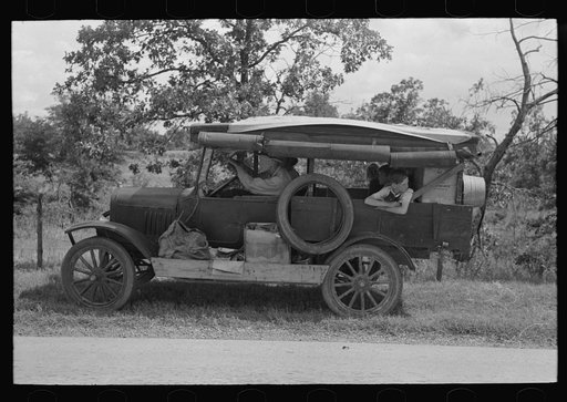 Family of white migrants in their automobile east of Fort Gibson, Muskogee County, Oklahoma