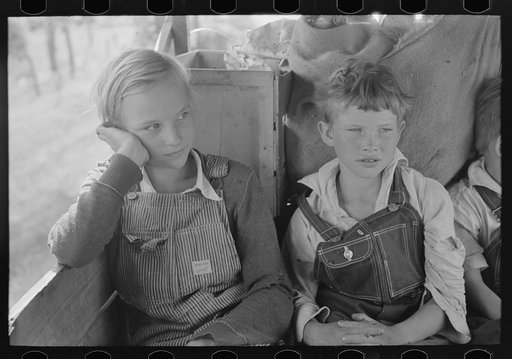 White migrant children sitting in back seat of family car east of Fort Gibson, Muskogee County, Oklahoma