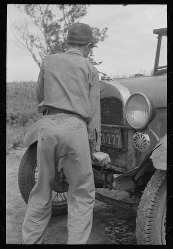 Untitled photo, possibly related to: Migrant boy getting ready to crank his car, Muskogee, Oklahoma