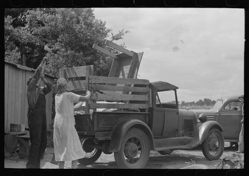 Untitled photo, possibly related to: Loading truck with table which will be carried by this migrant family to California near Muskogee, Oklahoma