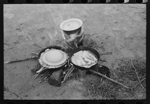 Fatback, potatoes and coffee being prepared by migrant family at Henrietta [i.e., Henryetta,] Oklahoma
