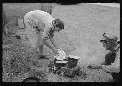 Making lunch along the roadside, near Henrietta [i.e., Henryetta,] Oklahoma. This is a migrant family en route to California