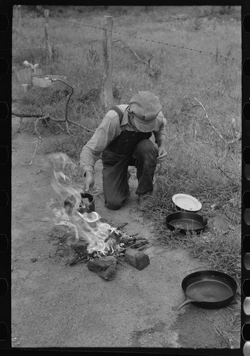 Untitled photo, possibly related to: Making lunch along the roadside near Henrietta [i.e., Henryetta,] Oklahoma. This is a migrant family en route to California