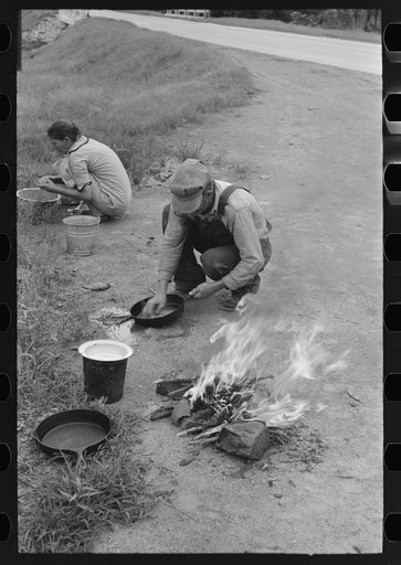 Making lunch along the roadside near Henrietta [i.e., Henryetta,] Oklahoma. This is a migrant family en route to California