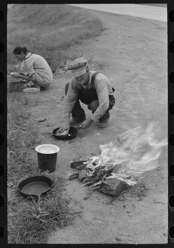 Making lunch along the roadside near Henrietta [i.e., Henryetta,] Oklahoma. This is a migrant family en route to California