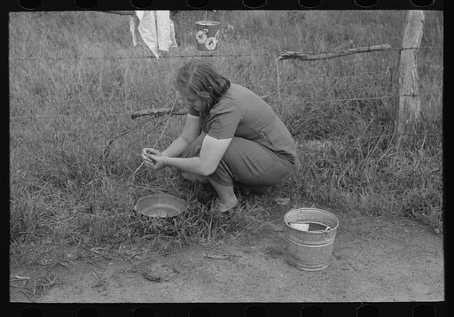Untitled photo, possibly related to: Women of a migrant family peeling potatoes near Henrietta [i.e., Henryetta,] Oklahoma