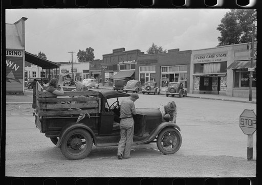 Migrant family's car stalled in main street of small town near Henrietta [i.e., Henryetta,] Oklahoma