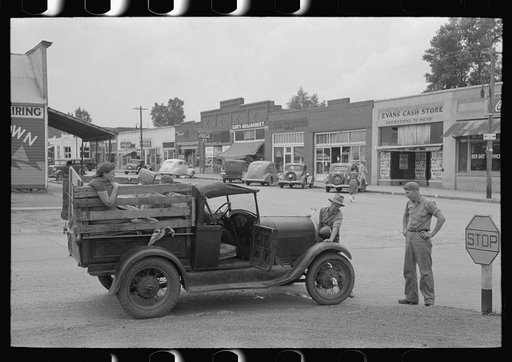 Migrant family's car stalled in main street of small town near Henrietta [i.e., Henryetta,] Oklahoma