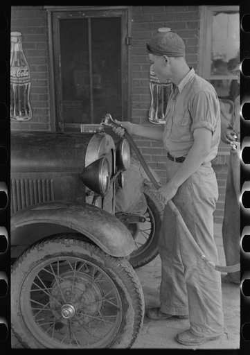 Filling radiator of migrant car with water. This is done frequently, as these radiators usually leak. Near Henrietta [i.e., Henryetta,] Oklahoma