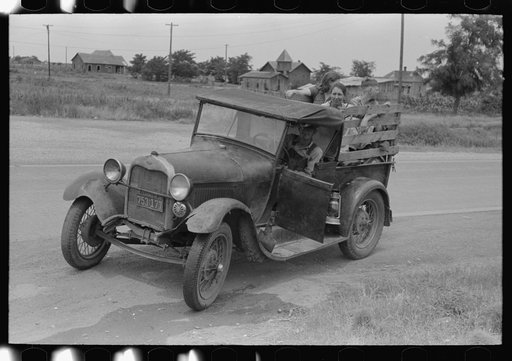 Untitled photo, possibly related to: Steaming car of migrant family en route to California at small town near Henrietta [i.e., Henryetta,] Oklahoma