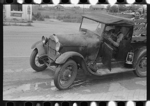 Steaming car of migrant family en route to California at small town near Henrietta [i.e., Henryetta,] Oklahoma