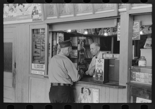 Tobacco dealer waiting on motorman at streetcar terminal, Oklahoma City, Oklahoma
