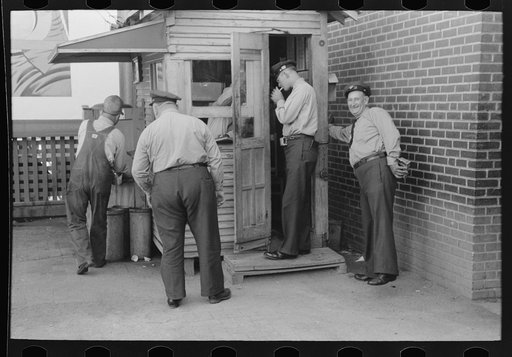 Untitled photo, possibly related to: Streetcar operators talking in terminal, Oklahoma City, Oklahoma