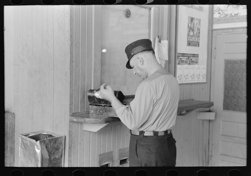 Untitled photo, possibly related to: Motorman with lunch basket making out reports. Streetcar terminal, Oklahoma City, Oklahoma