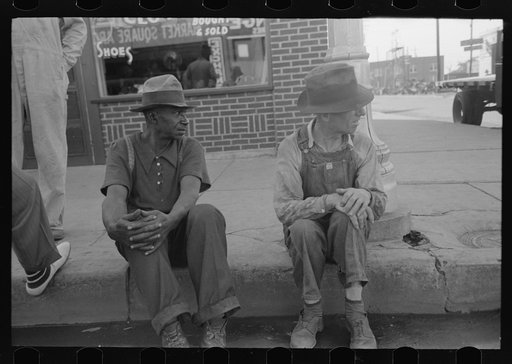 Untitled photo, possibly related to: Negro and white man sitting on curb talking, Muskogee, Oklahoma