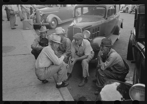 Untitled photo, possibly related to: Group of men talking in street of Muskogee, Oklahoma