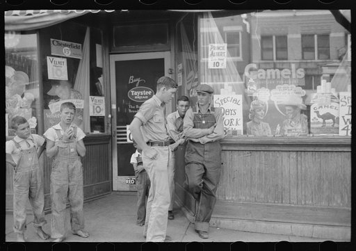 Untitled photo, possibly related to: Group of men talking in street of Muskogee, Oklahoma
