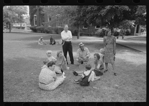 Untitled photo, possibly related to: Group of people sitting in square in front of courthouse, Tahlequah, Oklahoma