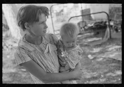 Untitled photo, possibly related to: Young girl holding baby brother in her arms, community camp, Oklahoma City Oklahoma