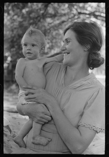 Untitled photo, possibly related to: Wife of carpenter and her baby who live in community camp, Oklahoma City, Oklahoma