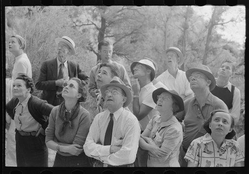 Untitled photo, possibly related to: Tourists looking for Indian hieroglyphic pointed out by ranger, Mesa Verde National Park, Colorado