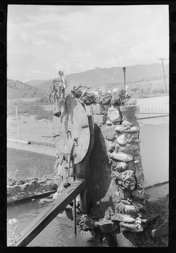 Untitled photo, possibly related to: Fountain and goldfish tank in garden of Italian merchant in Cimarron, New Mexico