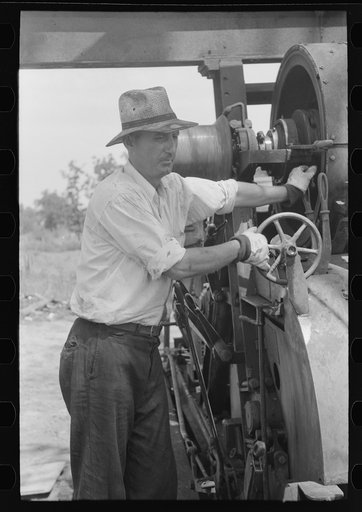 Untitled photo, possibly related to: Cable tool driller, Seminole oil field, Oklahoma