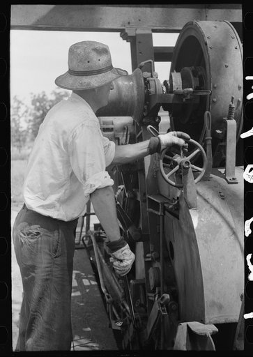 Untitled photo, possibly related to: Cable tool driller, Seminole oil field, Oklahoma