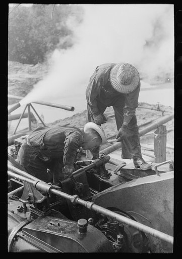 Untitled photo, possibly related to: Roughnecks working on engine, Seminole oil field, Oklahoma