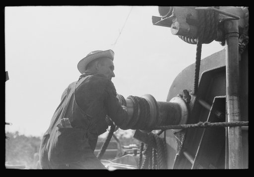 Untitled photo, possibly related to: Roughnecks working on engine, Seminole oil field, Oklahoma