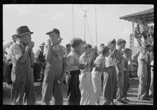 Untitled photo, possibly related to: End of the pie eating contest. Winner had hand raised. 4-H Club fair, Cimarron, Kansas