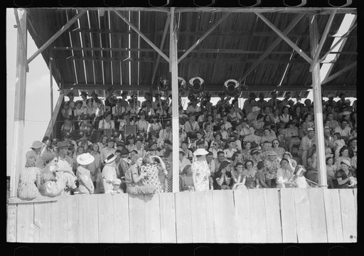 Spectators in the grandstand at 4-H club fair, Cimarron, Kansas