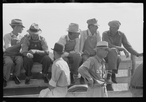 Untitled photo, possibly related to: Farmers sitting on the fence at 4-H Club fair, Cimarron, Kansas