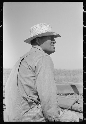One of the Davidson brothers who own a cooperative well made possible by FSA (Farm Security Administration) loan, Gray County, Kansas