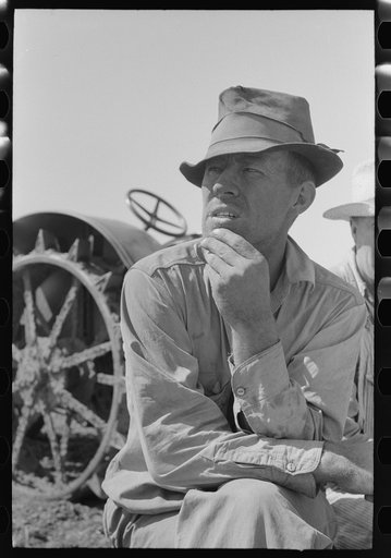 One of the Davidson brothers who own a cooperative well made possible by FSA (Farm Security Administration) loan, Gray County, Kansas