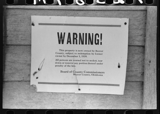 Sign on building in Forgan, Oklahoma, ghost dust town